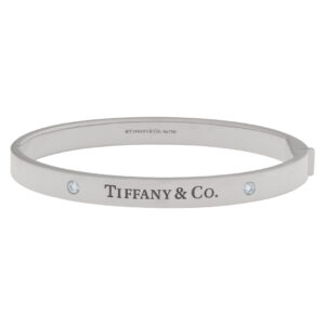 Tiffany & Co. Hinged Bangle bracelet in 18k White Gold with 2 Diamonds.