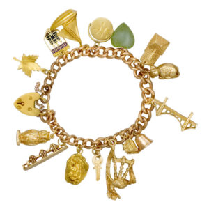 Assorted charm bracelet in 9k yellow gold; 8" long. Circa 1945