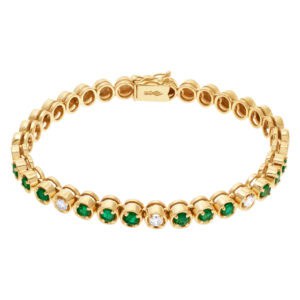 Gold bracelet with diamonds and green emerald accents