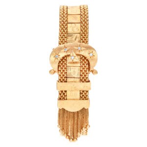 Buckle bracelet in 14k with diamond on buckle & tassel accents.