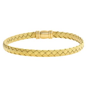 Braided flexible bangle in 18k yellow gold