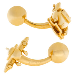 Cartier Cadillac and airplane cufflink set in 18k yellow gold.