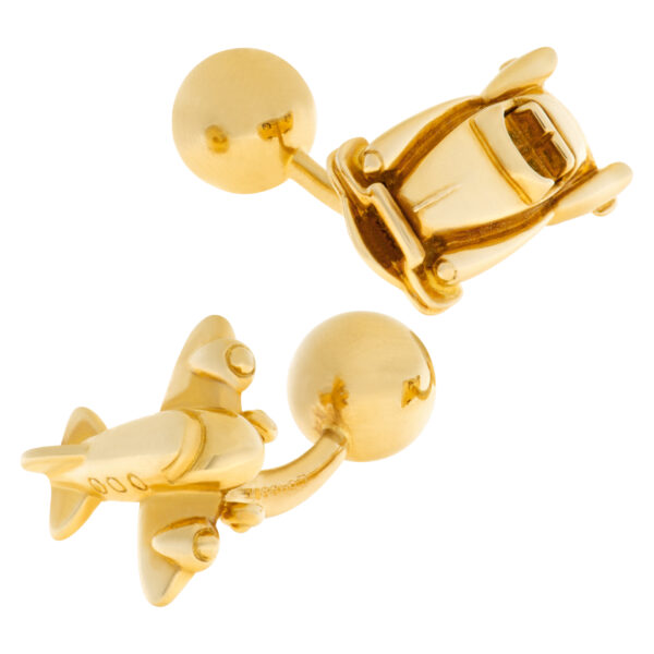 Cartier Cadillac and airplane cufflink set in 18k yellow gold.