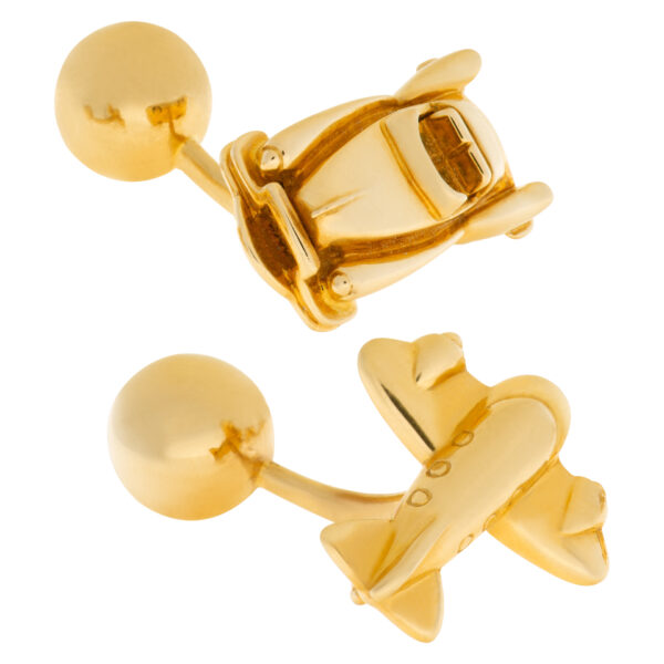 Cartier Cadillac and airplane cufflink set in 18k yellow gold.