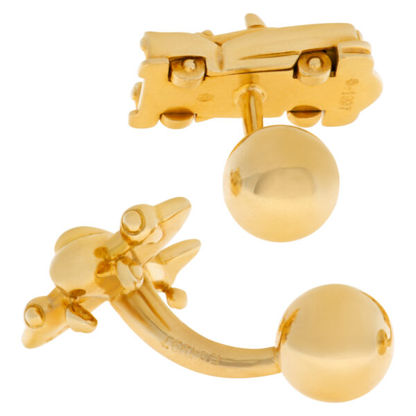 Cartier Cadillac and airplane cufflink set in 18k yellow gold.