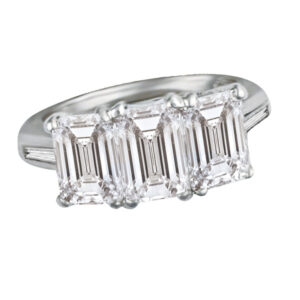 GIA Certified Three Stone Emerald Cut Diamond Ring set in Platinum with 3.04 carats total . Size 5.5