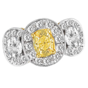 Fancy yellow diamond ring with 1.08 center diamond (SI1) & 0.59 cts in oval shape & 0.78 cts in roun