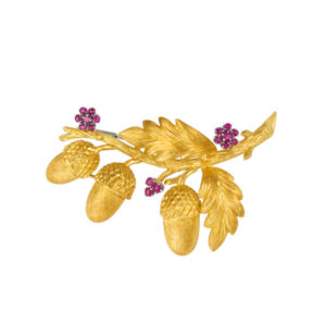 Brooch with ruby flower accents in 18k