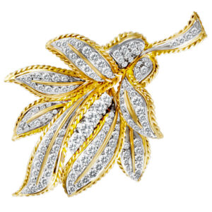 Leaf design broach in 18k with diamonds