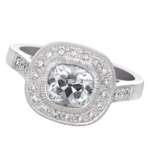 Diamond ring in platinum with 0.89 carat central cushion shape diamond.