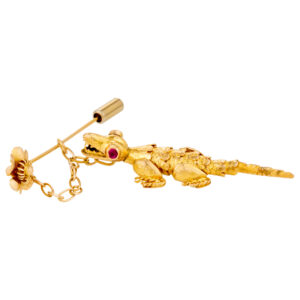 "GO GATORS" alligator pin with ruby eyes in 18k yellow gold.