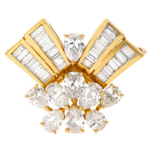 18k yellow gold spray pin with 9 pear shape diamonds and 32 baguettes. 9.38 carats total dia weight