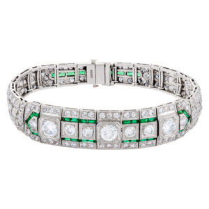 Vintage diamond platinum bracelet with french cut emerald accents approx. 8 carats in diamonds.