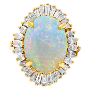 Australian opal ring in 18k with diamonds. 5.00 carats in rainbow fire opal