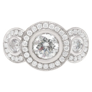 Three stone Halo style Diamond ring with approx. 1 carat center diamond.