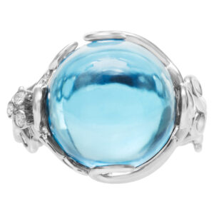 Funky Blue topaz ring in 18k white gold with diamond accents. Size 7.25.