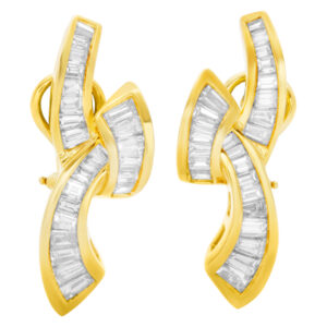 Cross over "hugs & kisses" baguette diamond earrings in 14k. 4.00cts (H-I, VS)