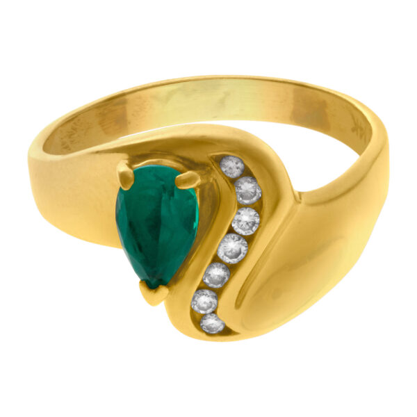 Pear shaped emerald ring with diamond accents in 14k gold. Size 10