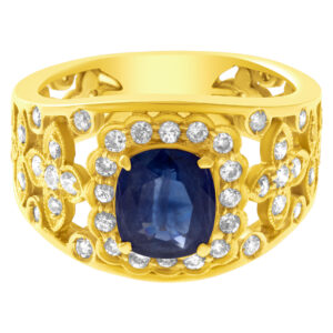 Sweet sapphire flower design ring in 18k with 0.40 cts in diamond accents. Size 7