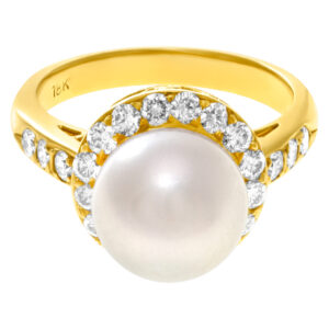 Pearl ring in 18k with diamond accents. 1.32 carats in diamonds. Size 6