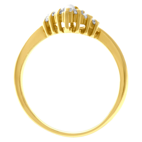 Marquise & baguette diamond ring set in 14k yellow gold. 0.90 carats. Size 5