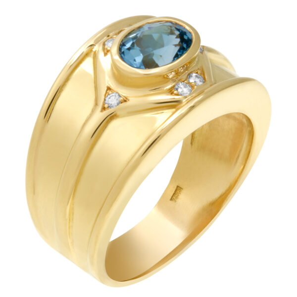 Aqua blue topaz ring with diamond accents set in 18k yellow gold