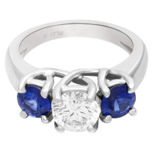 GIA certified round brilliant cut diamond 1.01 carat (H color, VS1 clarity) ring with 2 sapphires set in platinum.