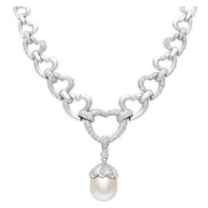 Elegant necklace in 14k white gold with diamond accents and 12mm pearl