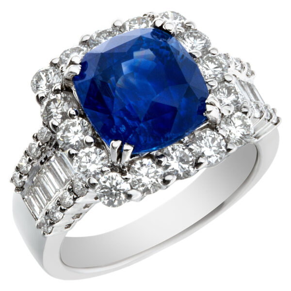 Sparkling 5.73 carat blue sapphire ring with diamond accents in 18k white gold