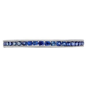 18k white gold eternity band with blue sapphires.