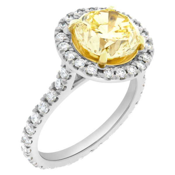 GIA certified round brilliant cut 3.13 carat (Natural, Fancy Intense Yellow, Even color, VVS1 clarity, Excellent symmetry) ring