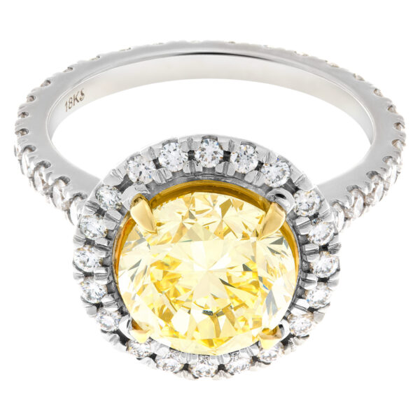 GIA certified round brilliant cut 3.13 carat (Natural, Fancy Intense Yellow, Even color, VVS1 clarity, Excellent symmetry) ring