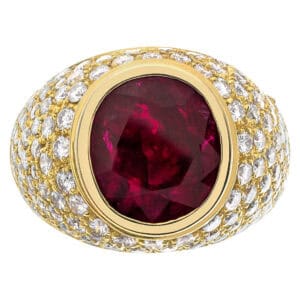 Large oval ruby ring with white diamonds in 18k gold