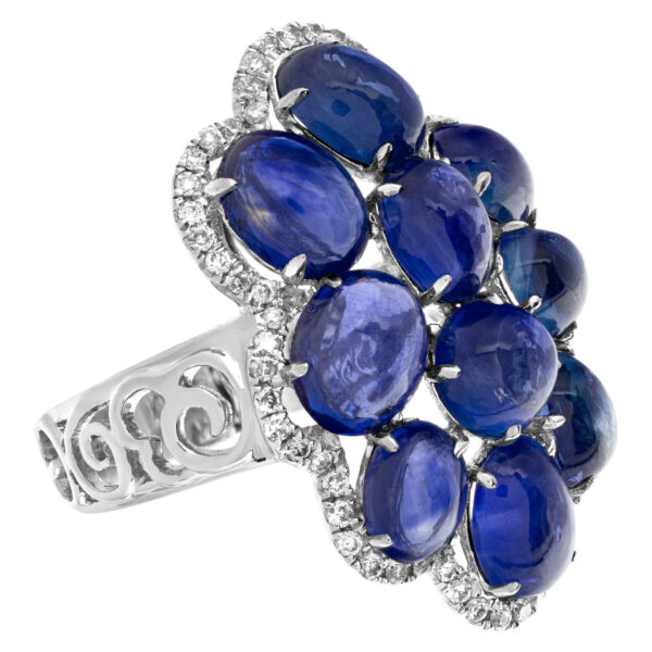 Blue cabachon tanzanite ring with diamond accents in 18k white gold