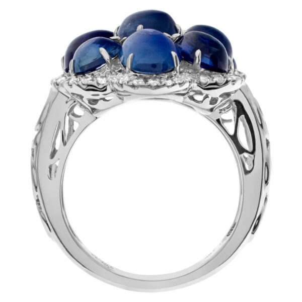 Blue cabachon tanzanite ring with diamond accents in 18k white gold