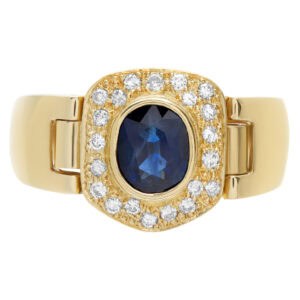 Sapphire center and diamond accents ring in 14k yellow gold, approximately 0.21 carat in diamonds