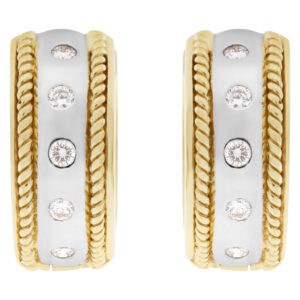 Huggies earrings with diamond accents in 14k white and yellow gold