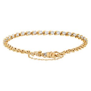 Delicate line diamonds bracelet with approximately 1.50 carat full cut round brilliant diamonds set in 14K yellow gold