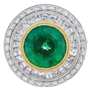 Emerald and diamond ring in 18k yellow and white gold.