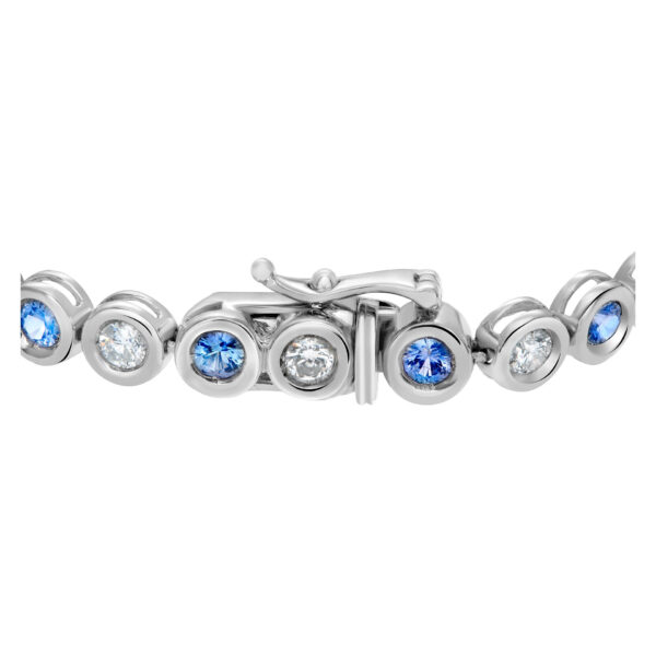 Bezel set blue sapphire and diamond tennis bracelet in 18k white gold