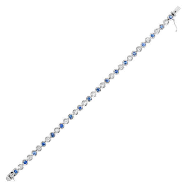 Bezel set blue sapphire and diamond tennis bracelet in 18k white gold