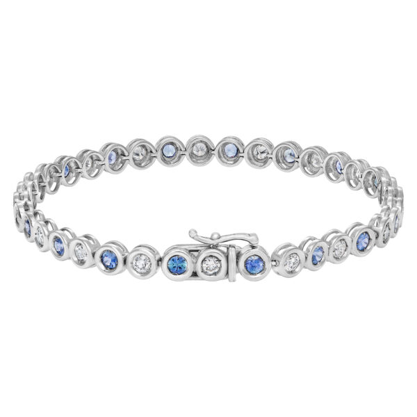 Bezel set blue sapphire and diamond tennis bracelet in 18k white gold