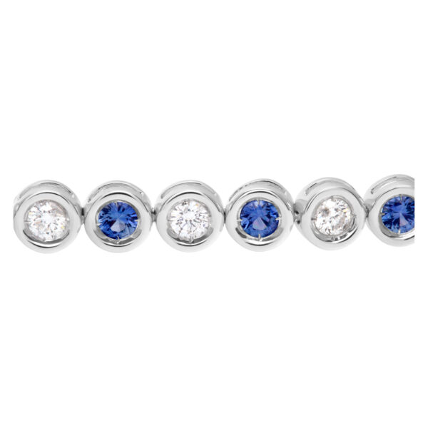 Bezel set blue sapphire and diamond tennis bracelet in 18k white gold