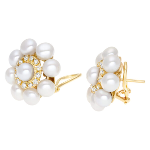 Elegant pair of  pearl earrings (5 x5.5mm) with diamonds accent., set in 18K yellow gold with post and omega clip on.