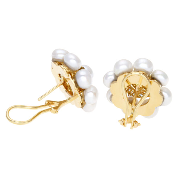 Elegant pair of  pearl earrings (5 x5.5mm) with diamonds accent., set in 18K yellow gold with post and omega clip on.