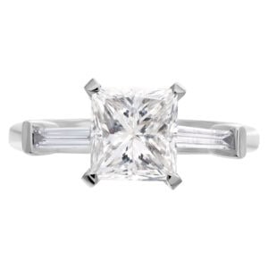 GIA certified princess cut 2.0 carat diamond of (I color and SI1 clarity) in a platinum setting with 2 side  baguettes. Size 6.5. Length 1". Width 2.8mm