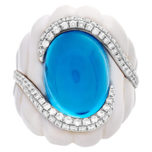 Michael Christoff agate and topaz ring. The floating cabochon topaz of sky blue color and 14.43 carat is surrounded by a swirl of round G-H, I1-I2  diamond of 0.75 carats and a 31.83 carat fancy cut white agate stone.