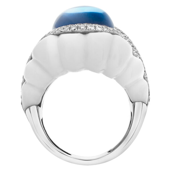 Michael Christoff agate and topaz ring. The floating cabochon topaz of sky blue color and 14.43 carat is surrounded by a swirl of round G-H, I1-I2  diamond of 0.75 carats and a 31.83 carat fancy cut white agate stone.