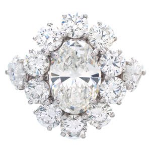 GIA Certified Graff diamond cluster ring in platinum. Center 2.11 ct oval diamond (F, VS2). 5.25 carats total weight