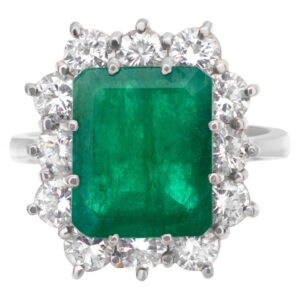 Elegant emerald and diamond ring set in 18k white gold